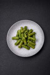 Delicious pasta with spinach sauce, olive oil and parmesan cheese