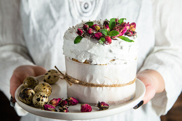 Easter cake with Swiss meringue and  flowers. Easter eggs