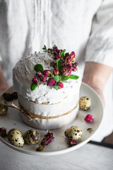 Easter cake with Swiss meringue and  flowers. Easter eggs