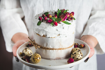 Easter cake with Swiss meringue and  flowers. Easter eggs