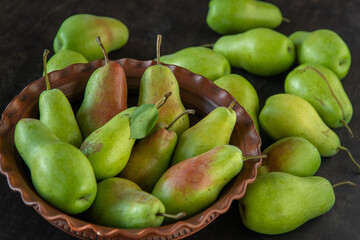 Parisian pear variety. Fruits on the table. Autumn harvest. Pears top view background. Green yellow red color pear. Vitamin vegan food.
