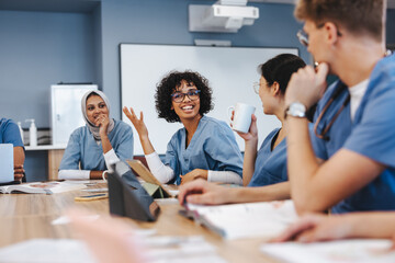 Group of multicultural medical students discuss the topics of a research