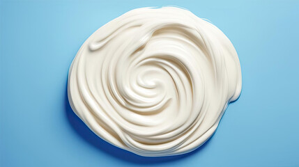 brushstroke of white isolated on blue background. white paste smeared on the table