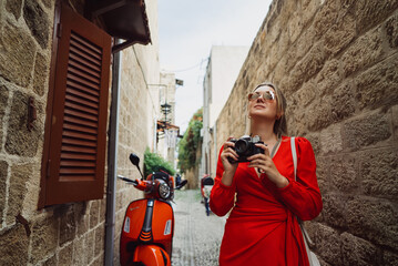 Woman takes photographs of the ancient city.
