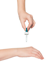 Women's hands hold pipette with cosmetic serum. Isolate. Close-up, copy space. Concept of body care.