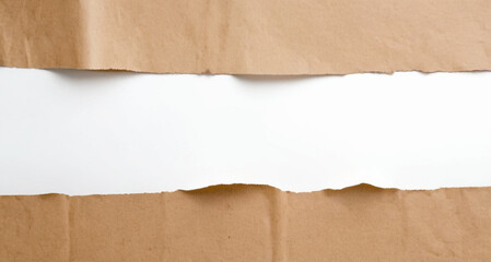Ripped in brown paper on a white background