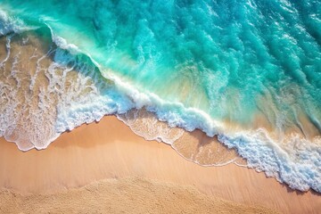 The concept of rest and travel. Beautiful background. Top view of the white sand beach and the rolling foamy wave of the turquoise ocean.