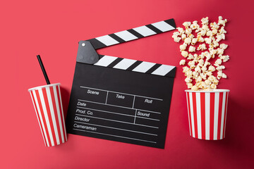 Popcorn bucket with soda cup and Cinema clapper board, sweet drink, cinematography entertainment,...