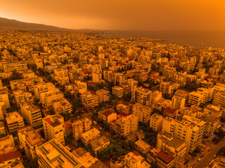 Athens,Greece,April 23,2024.Dust from Africa covers everything.View from a drone at sunset ,Palio Faliro,Greece