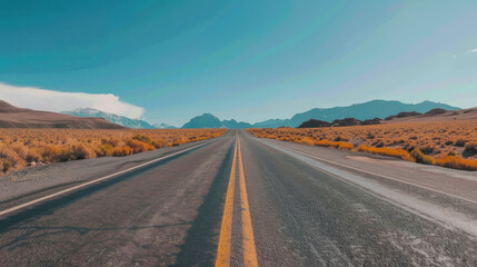 An empty, open road stretching into the horizon under a clear sky, the simplicity of the scene evoking a sense of freedom and endless possibility.