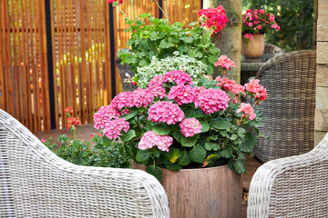 flower arrangements with garden flowers decorate the summer veranda