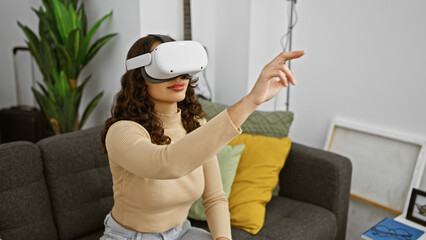 Young woman wearing vr headset interacts with virtual content in her modern living room