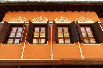 Row of windows on the facade of the Balabanov House, an example of National Revival Architecture in...