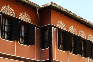 Decorated windows on the facade of the Balabanov House, an example of National Revival Architecture...