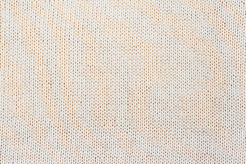 Sweater or scarf fabric texture large knitting. Knitted jersey background with a relief pattern. Wool hand- machine, handmade. - Powered by Adobe
