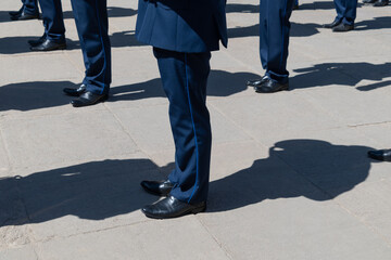 Men in identical blue suits