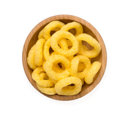 Wooden bowl with corn ring crisps isolated on white, top view