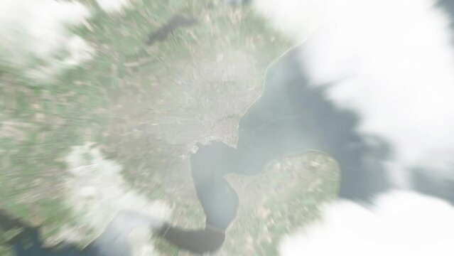 Earth zoom in from space to Fredericia, Denmark. Followed by zoom out through clouds and atmosphere into space. Satellite view. Travel intro. Images from NASA