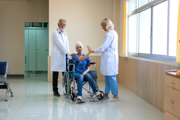 Professional medical doctor team with stethoscope in uniform discussing with patient woman with...