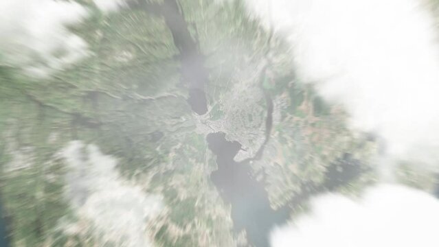 Earth zoom in from space to Larvik, Norway. Followed by zoom out through clouds and atmosphere into space. Satellite view. Travel intro. Images from NASA