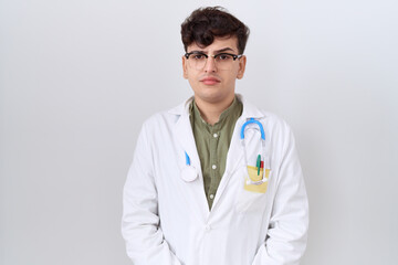 Young non binary man wearing doctor uniform and stethoscope skeptic and nervous, frowning upset because of problem. negative person.