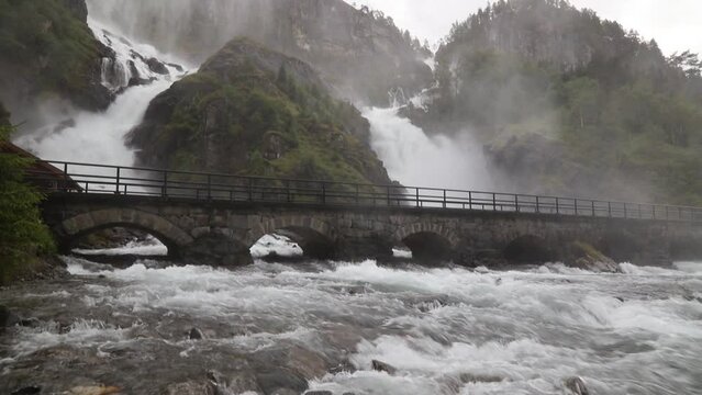 Latefossen waterfall in Hordaland, Norway. Old stone bridge.