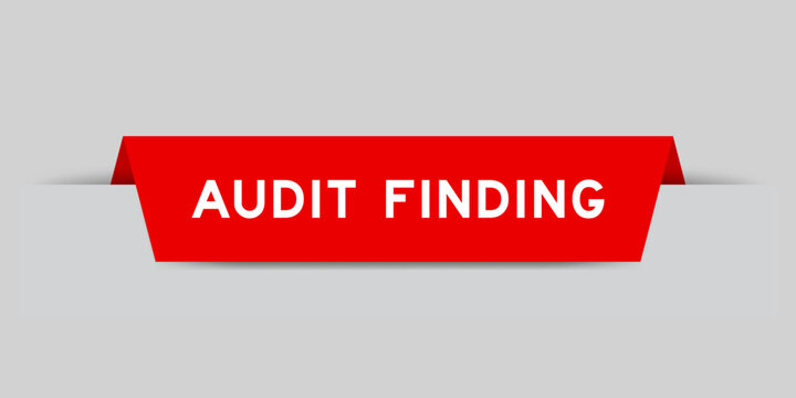 Red color inserted label with word audit finding on gray background