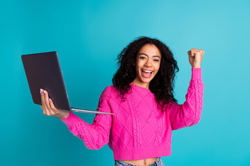 Photo portrait of lovely teen lady hold netbook winning dressed stylish pink garment isolated on...