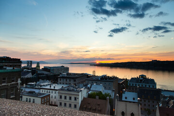 Sunrise high angle view of the lower old town, the port and the St. Lawrence River seen from the upper town, Quebec City, Quebec, Canada