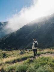 Woman Hiking in Misty Mountain Landscape