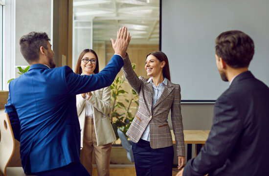 Business people high five happy team celebration or office greeting. Startup becoming radically productive, leadership and communications skills development, successful coaching or management
