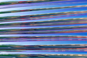 Shiny pink reflective surface with stripes.