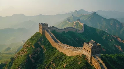 The Chinese great wall at Badaling in the mountains in the north of the capital Beijing. Wonder of the world. Beautiful view. Famous ancient wall of China. Travel concept. Asian history. Green hills.