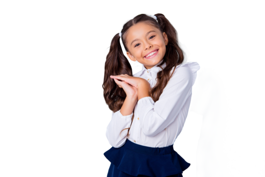 New school year! Nice cute tender cheerful adorable lovely stylish girl with curly pigtails in white formal blouse and dark blue skirt, showing delighted gesture. Isolated over grey background