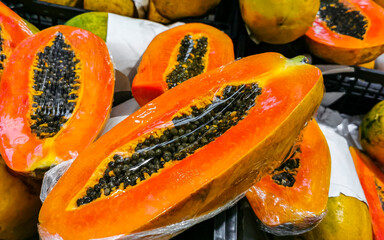 Wrapped packaged sliced papaya fruit in Playa del Carmen Mexico.