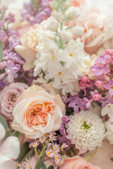 Small bouquet with pastel flowers on white background