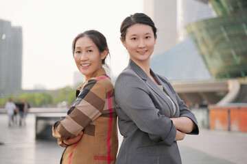 Confident Businesswomen Posing in Modern City Environment
