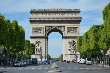 The Arc de Triomphe standing tall at the end of the Champs-Elysees in Paris