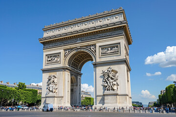 Fototapeta na wymiar The Arc de Triomphe standing tall at the end of the Champs-Elysees in Paris