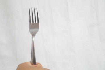 A fork is shown in a white background