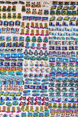 Wall of vibrant, colorful souvenir magnets from Bodrum, featuring popular Turkish themes and icons, perfect for travel and cultural promotions. Bodrum, Mugla, Turkey (Turkiye) © Elena