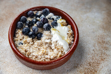 oatmeal with berries healthy breakfast porridge fresh cooking appetizer meal food snack on the...