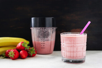 Strawberry and banana smoothie drink, blended cocktail, milkshake in a glass