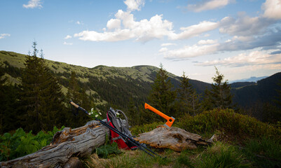 Obraz premium Hiking with a backpack and an ax in the mountains