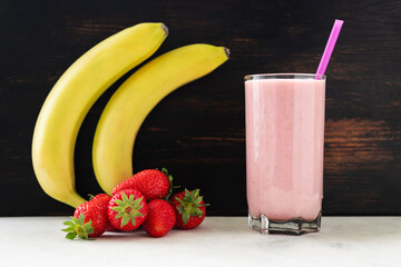 Strawberry and banana smoothie drink, blended cocktail, milkshake in a glass