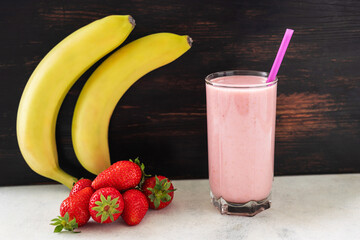 Strawberry and banana smoothie drink, blended cocktail, milkshake in a glass