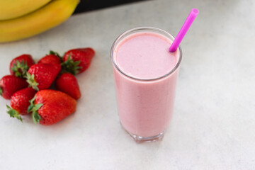 Strawberry and banana smoothie drink, blended cocktail, milkshake in a glass