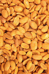 Peeled salted peanuts as background, top view. Lots of roasted peanuts