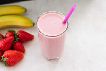 Strawberry and banana smoothie drink, blended cocktail, milkshake in a glass