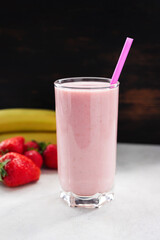 Strawberry and banana smoothie drink, blended cocktail, milkshake in a glass